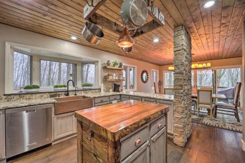 a large kitchen with a wooden ceiling and wooden counters at Luxe Beech Mtn Cabin with Hot Tub 2 Mi to Skiing! in Beech Mountain