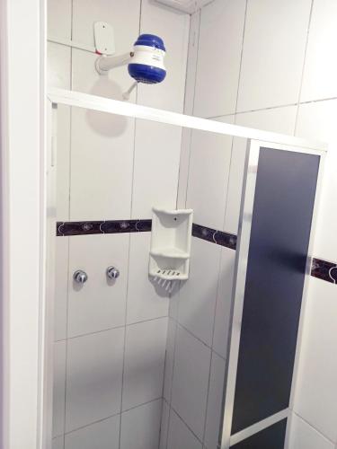 a bathroom with a shower with a mirror at Solar Hostel Beach Copacabana in Rio de Janeiro