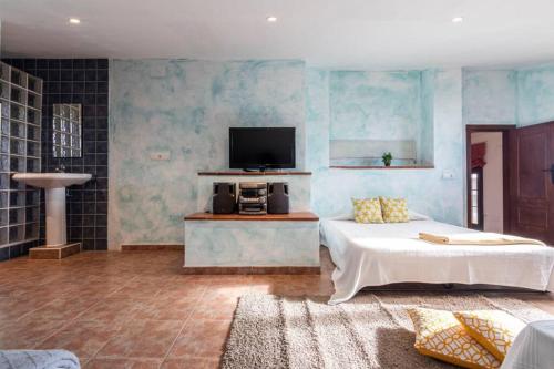 A bed or beds in a room at Lo Guaret.