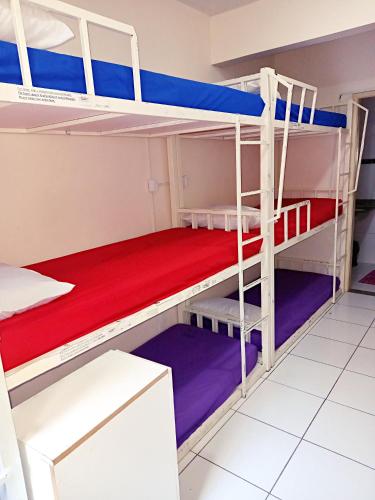 a bunk bed room with two bunk beds at Solar Hostel Beach Copacabana in Rio de Janeiro