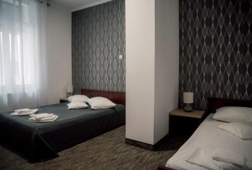 Postel nebo postele na pokoji v ubytování Carnival City Hotel Oradea
