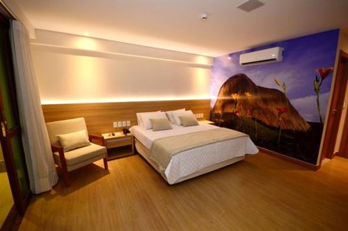 Tempat tidur dalam kamar di condominio Vista azul
