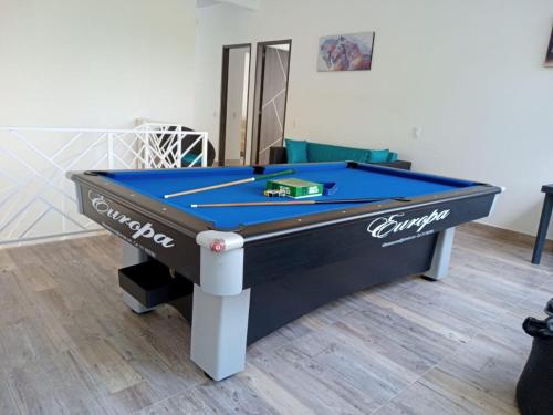 a pool table in a room with at CASA EL MIRADOR in Anapoima