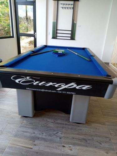a blue pool table with a cue on top of it at CASA EL MIRADOR in Anapoima