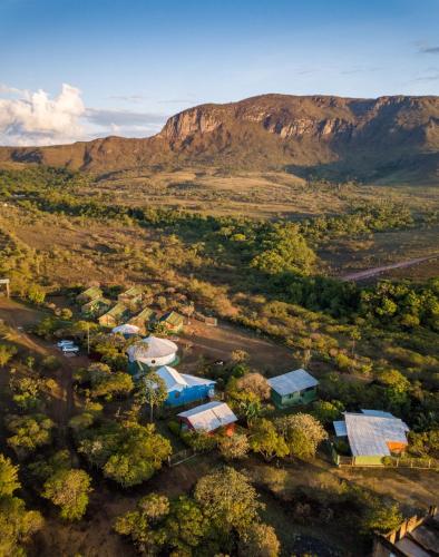 an aerial view of a village with a mountain in the background at Pousada Morro da Baleia in Alto Paraíso de Goiás