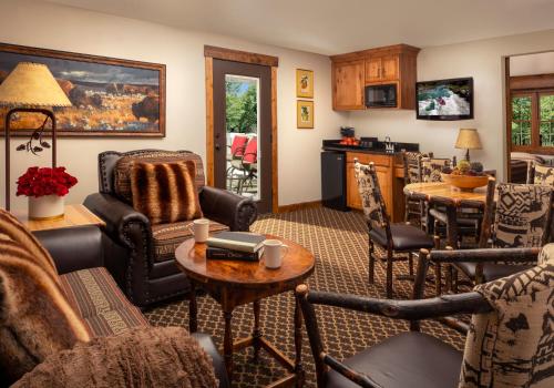 
a living room filled with furniture and a fireplace at Parkway Inn of Jackson Hole in Jackson
