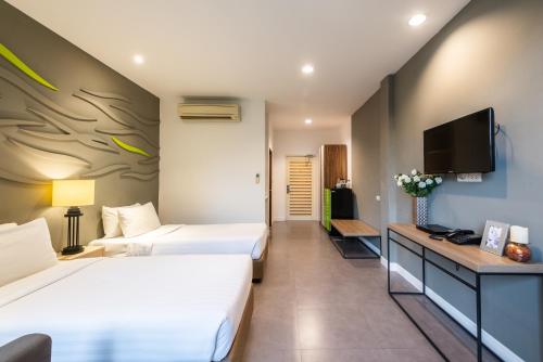 Ένα ή περισσότερα κρεβάτια σε δωμάτιο στο Paeva Luxury Serviced Residence SHA