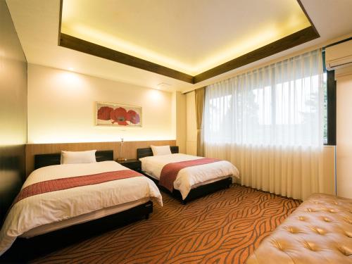 Llit o llits en una habitació de House Hotel Kenrokuzaka