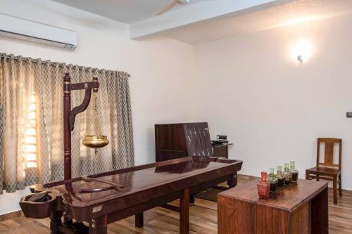 a room with a ping pong table in a room at StayVista at Springhills Villa & Ayurvedic Spa in Cochin