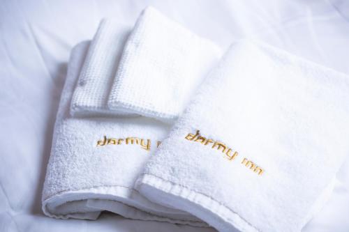 two white towels with happy anniversary written on them at Dormy Inn Premium Nagasaki Ekimae in Nagasaki
