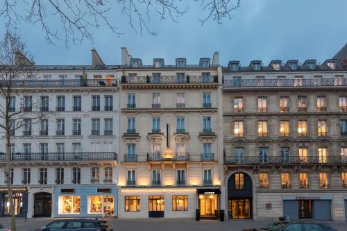 a large white building with many windows at Montfleuri in Paris