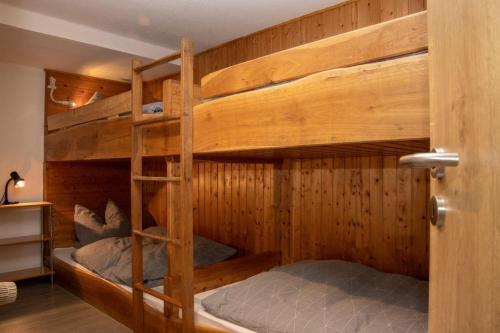 a couple of bunk beds in a room at Xavers Ranch in Meschede