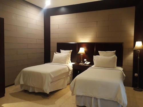 Кровать или кровати в номере Alsalam Syariah Guesthouse