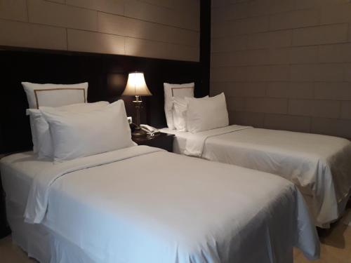 Кровать или кровати в номере Alsalam Syariah Guesthouse