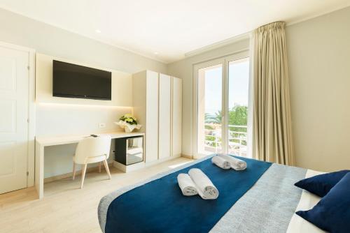 Un pat sau paturi într-o cameră la Hotel Corallo