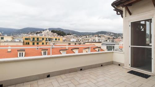 a balcony with a view of a city at Italianway - Roma 70 in Sanremo
