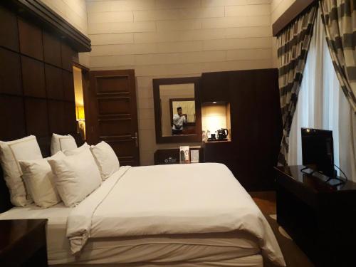 Кровать или кровати в номере Alsalam Syariah Guesthouse