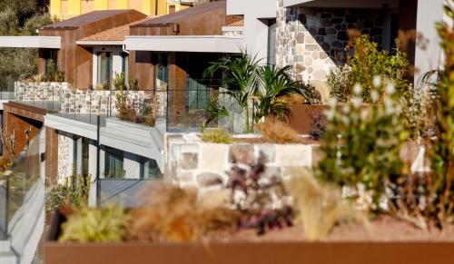 a building with plants on the side of it at Deville & Spa in Costermano sul Garda