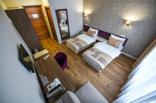 an overhead view of a hotel room with two beds at Hotel Zepter Palace in Banja Luka