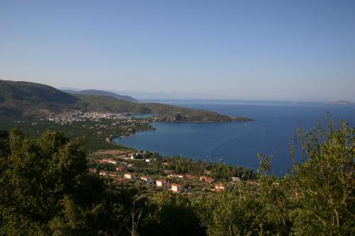 a view of a town and a body of water at Saronis Hotel in Ancient Epidauros