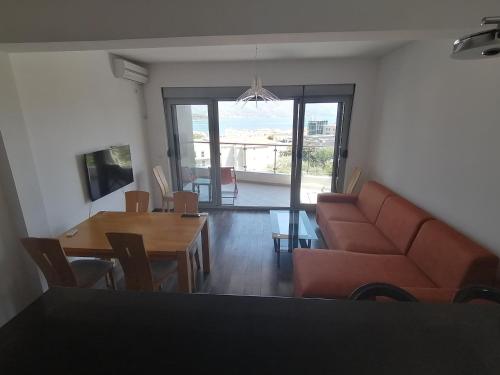 a living room with a couch and a table at Old Town View Apartment in Budva