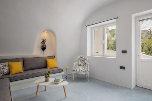 a living room with a couch and a chair at Ecolodge Cave House in Vóthon
