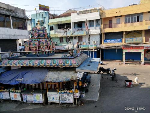a building with a colorful in a city at AMINA LODGE in Port Blair