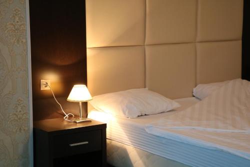 Кровать или кровати в номере Гостиница Беркат