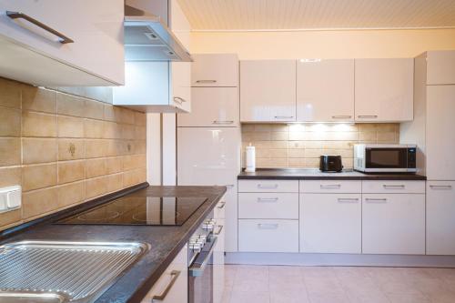 Kuchyň nebo kuchyňský kout v ubytování Ferienhaus Martens