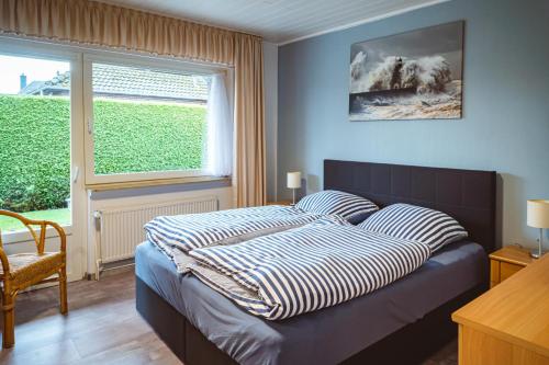 Una cama o camas en una habitación de Ferienhaus Martens