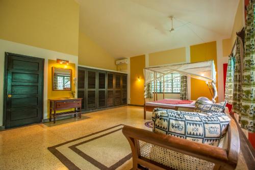 a living room with a bed and a table at Jamboland-Diani in Diani Beach