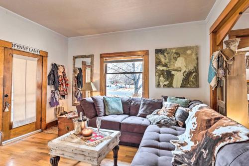 a living room with a couch and a table at Lovely Montrose Home with Yard Walk to Dtwn and Park! in Montrose