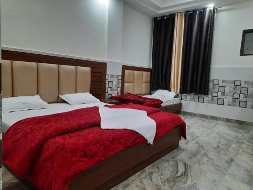 A bed or beds in a room at Abrol residency