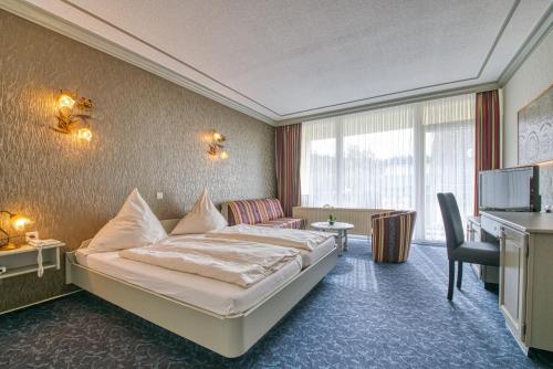 מיטה או מיטות בחדר ב-Hotel Haus Tiefenbach