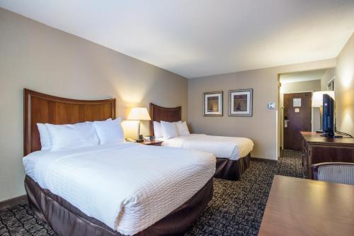 Una cama o camas en una habitación de Cayuga Blu