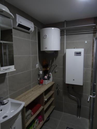 Kuchyň nebo kuchyňský kout v ubytování Apartman N&N