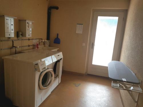 a laundry room with a washing machine and a window at priv. Apartment bei Swiss Holiday Park in Morschach