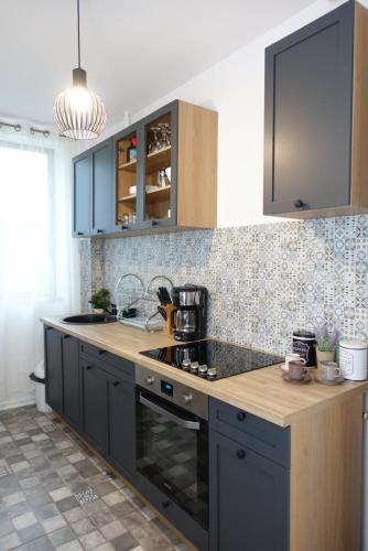 A kitchen or kitchenette at Balcescu Apartment Self Check-in