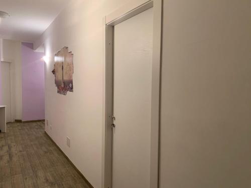 an open door in a room with a wall at BONORUM De Spuches in Palermo