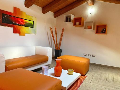 a living room with a couch and a table at Gioia Guesthouse in Càbras