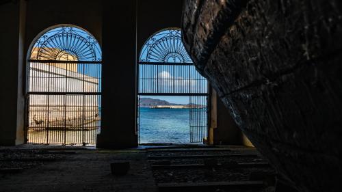 a view of the ocean from a room with two windows at Elimi Favignana Apartments - Residence in città in Favignana
