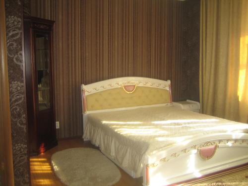 Un ou plusieurs lits dans un hébergement de l'établissement Mini Hotel Alikhan