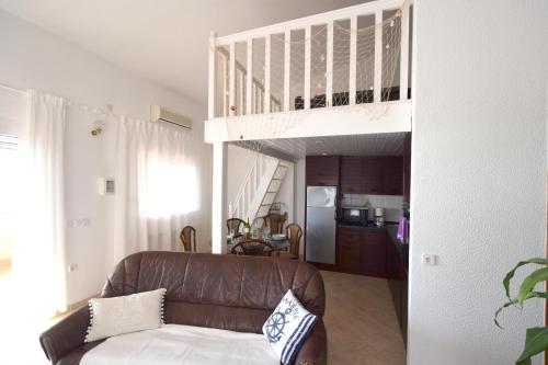 a living room with a couch and a loft at Apartment Luis in Pinezici