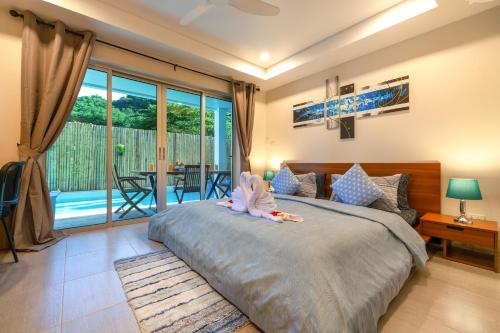 Postel nebo postele na pokoji v ubytování Dreambeach 2-villas