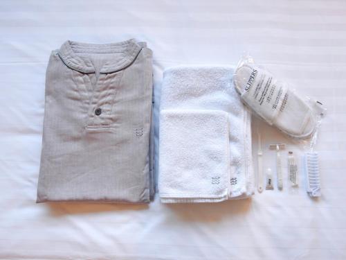 a pair of shorts and a sweater and a towel at Hotel Pacific Kanazawa in Kanazawa