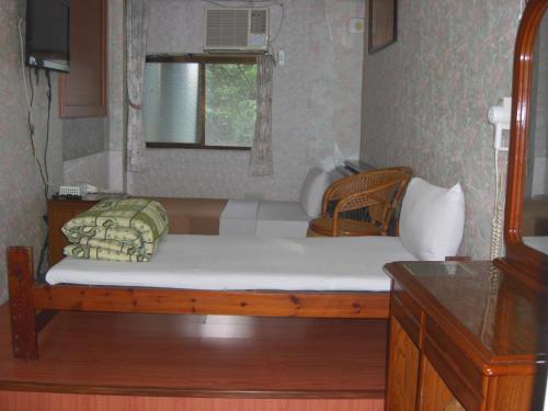 Cama o camas de una habitación en Uni Hotel