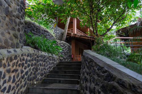 a set of stairs leading to a house at Tira Vilagna Suites & Spa in Kintamani