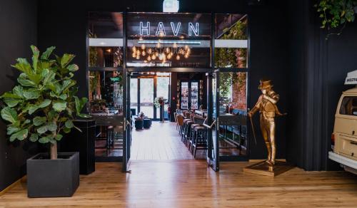 a restaurant with a mannequin standing in the doorway at LOFTSTYLE Hotel Hannover, Best Western Signature Collection in Hannover