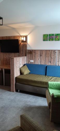 a bedroom with a large bed and a tv at Gasthaus-Pension Hofmann in Oberdachstetten