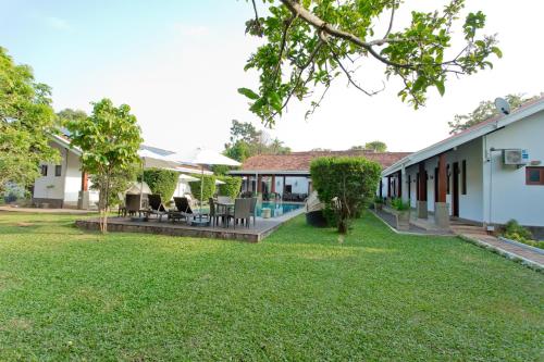 an image of the backyard of a house at Swanee Grand in Negombo